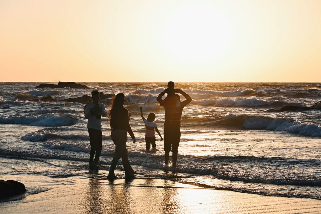 Family at beach building a life worth living